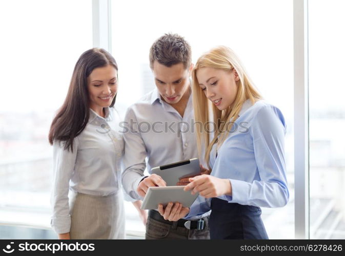 business and office concept - smiling business team working with tablet pcs in office