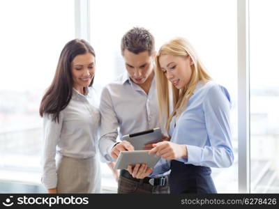 business and office concept - smiling business team working with tablet pcs in office