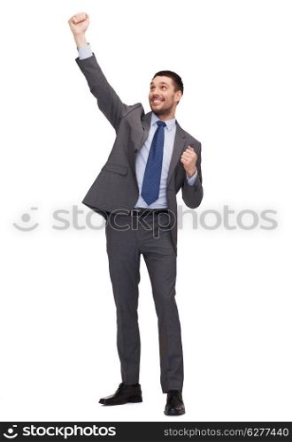 business and office concept - young happy businessman with hands up celebrating victory