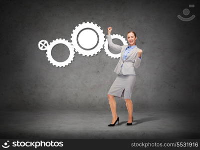 business and office concept - young happy businesswoman with hands up