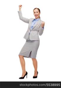 business and office concept - young happy businesswoman with hands up
