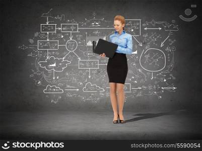 business and office concept - young smiling businesswoman with folder
