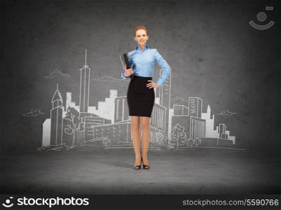 business and office concept - young smiling businesswoman with folder and city drawing in the back