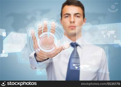 business and office, future technology concept - attractive buisnessman working with virtual screen