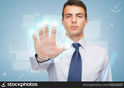 business and office, future technology concept - attractive buisnessman working with virtual screen