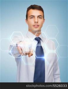 business and office, people concept - friendly young buisnessman pointing finger to virtual screen