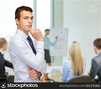 business and office, people concept - pensive young buisnessman at office