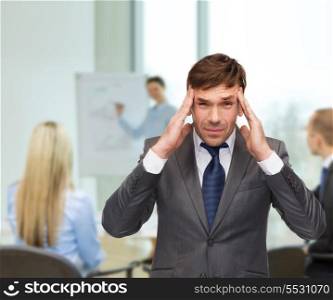 business and office, stress, problem, crisis concept - stressed buisnessman or teacher having headache at office