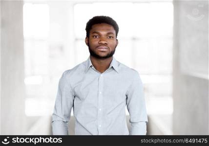 business and people concept - african american businessman at office. african american businessman at office. african american businessman at office
