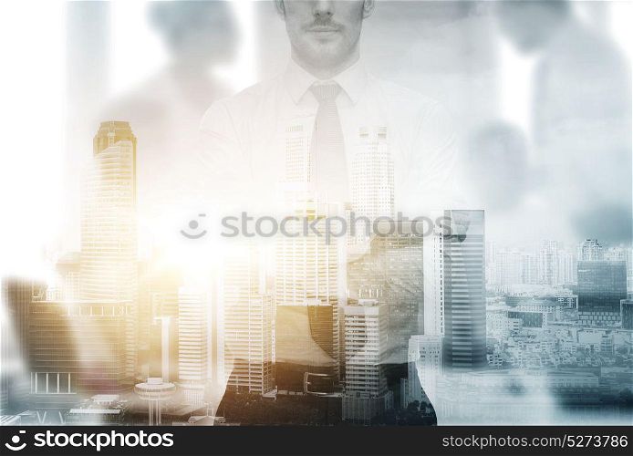 business and people concept - close up of businessman over city background and double exposure effect. close up of businessman over city background