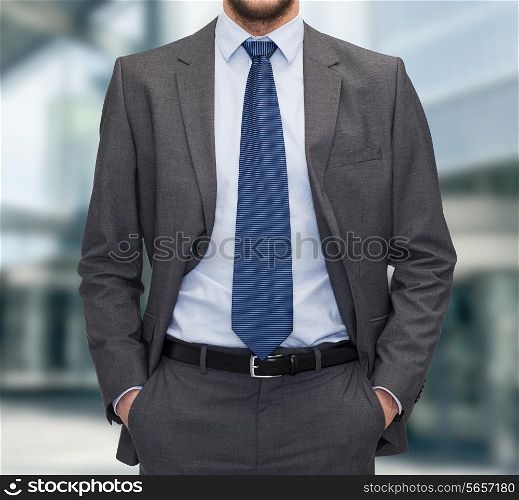 business and people concept - close up of businessman standing over business center background
