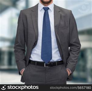 business and people concept - close up of businessman standing over business center background