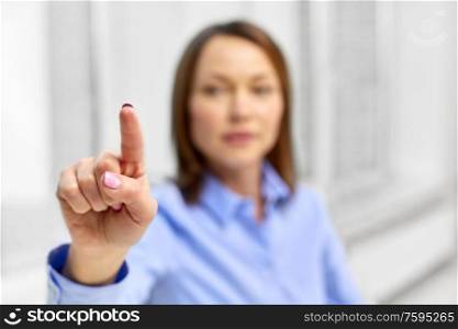 business and people concept - close up of businesswoman touching something with finger. businesswoman touching something with finger