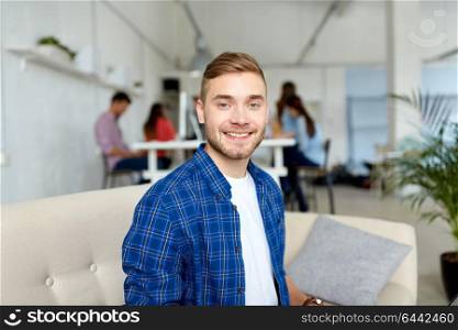 business and people concept - happy creative male office worker or student. happy creative male worker at office or student