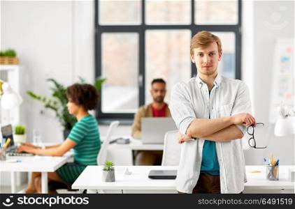 business and people concept - man with glasses at office. man with glasses at office. man with glasses at office
