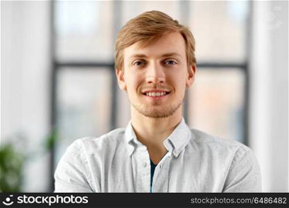 business and people concept - portrait of happy smiling man at office. portrait of happy smiling man at office. portrait of happy smiling man at office