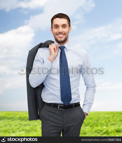 business and people concept - smiling young and handsome businessman