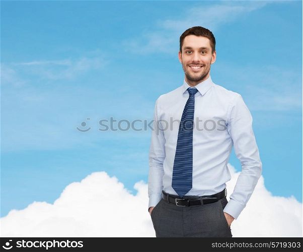 business and people concept - smiling young and handsome businessman over blue sky with white cloud background