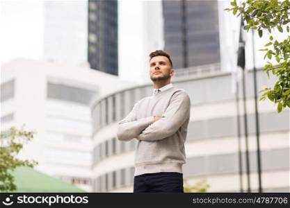 business and people concept - young man on city street. young man on city street