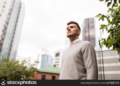 business and people concept - young man on city street. young man on city street