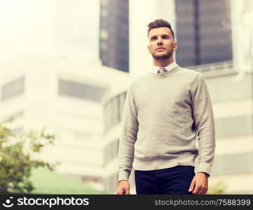 business and people concept - young man on city street. young man on city street