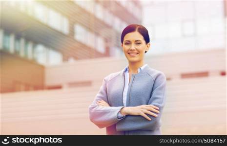 business and people concept - young smiling businesswoman over office building. young smiling businesswoman over office building. young smiling businesswoman over office building