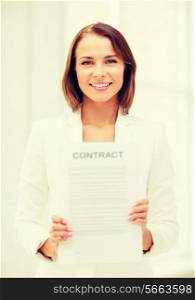 business and real estate concept - businesswoman holding contract