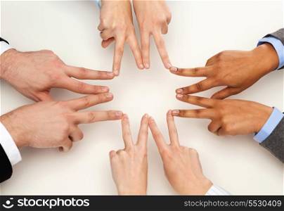 business and succcess concept - group of businesspeople showing v-sign