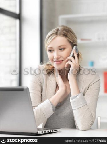 business and technology concept - businesswoman with cell phone