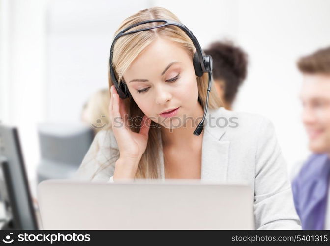 business and technology concept - helpline operator with headphones in call centre