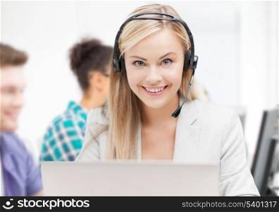 business and technology concept - helpline operator with headphones in call centre