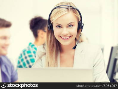business and technology concept - helpline operator with headphones in call centre. helpline operator with headphones in call centre