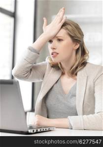 business and technology concept - picture of stressed woman with laptop computer