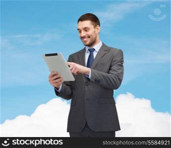 business and technology concept - smiling businessman with tablet pc computer