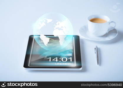 business and technology concept - tablet pc with sign of globe