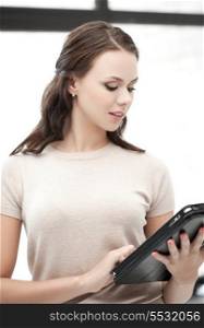 business and technology concept - woman with tablet pc computer or touchpad