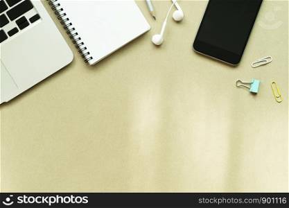 Business and working space background concept. Laptop, notebook, mobile and accessories on table with free space for text.