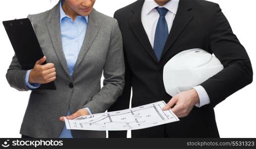business, architecture and development concept - businesswoman and businessman with clipboard, bluepring and white helmet
