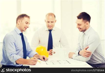business, architecture and office concept - happy team of architects and designers in office