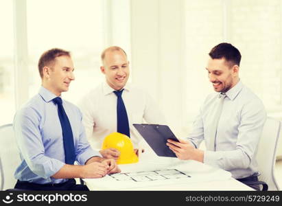 business, architecture and office concept - happy team of architects and designers in office