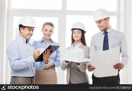 business, architecture and office concept - happy team of architects in office