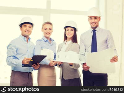 business, architecture and office concept - happy team of architects in office