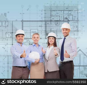 business, architecture and office concept - happy team of architects in office showing thumbs up