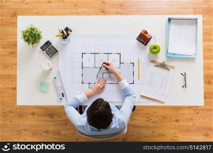 business, architecture, building and construction concept - architect woman with compass measuring blueprint of living house at office. architect with compass measuring blueprint
