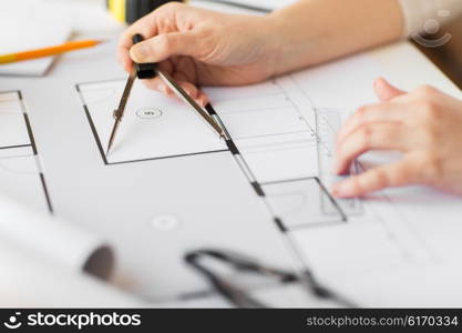 business, architecture, building, construction and people concept - close up of architect hands with compass measuring living house blueprint