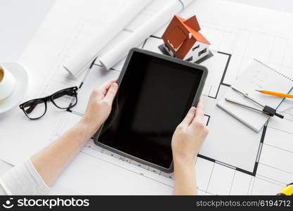 business, architecture, building, construction and people concept - close up of architect hand with living house blueprint and tablet pc computer