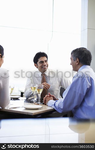 Business associates smiling having business meeting