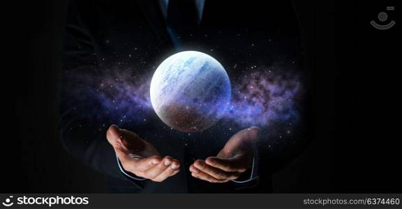 business, astronomy, augmented reality and people concept - close up of businessman with virtual planet hologram. close up of businessman with planet hologram