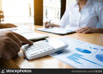 business audits using a calculator financial data investment fund at a workplace, wealth concept