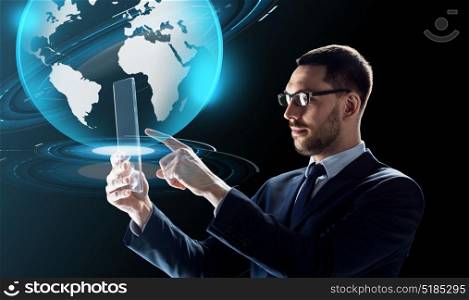 business, augmented reality and future technology concept - businessman in glasses working with transparent tablet pc computer and virtual earth globe hologram over black background. businessman with tablet pc and virtual globe